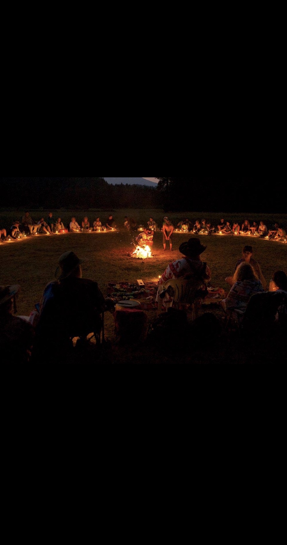 A fireside ceremony circle at dusk